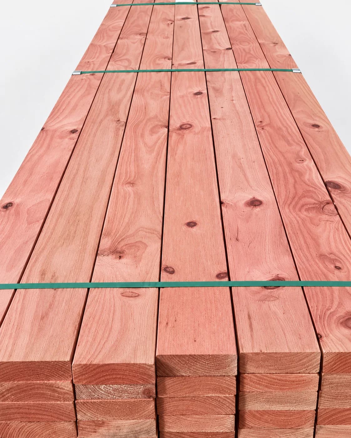 Pink treated Radiata Pine structural timber bundle.