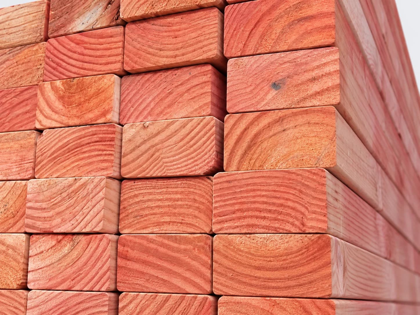 Close-up of red treated Radiata Pine structural timber.