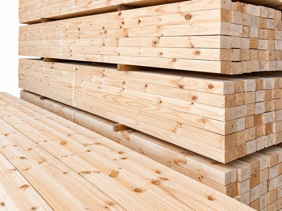 Stacked Radiata Pine timber bundles.