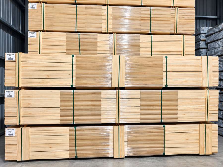 Radiata pine timber bundles stored in a warehouse.
