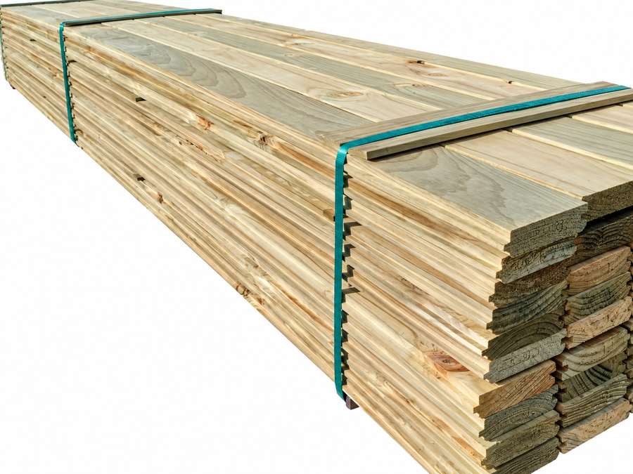Stacked treated radiata pine decking bundle.