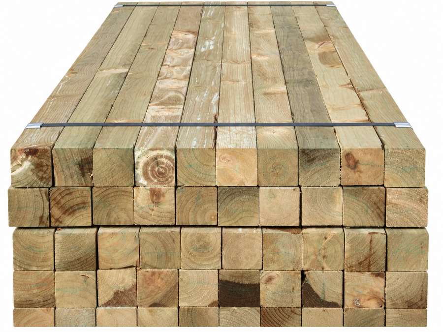 Stacked treated radiata pine timber posts.